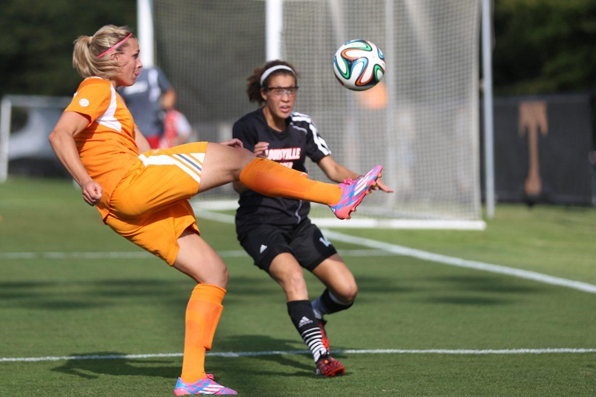 Senior forward Hannah Wilkinson (orange) corrals the ball during the Lady Vols' tied match against the Louisville Cardinals Aug. 14.