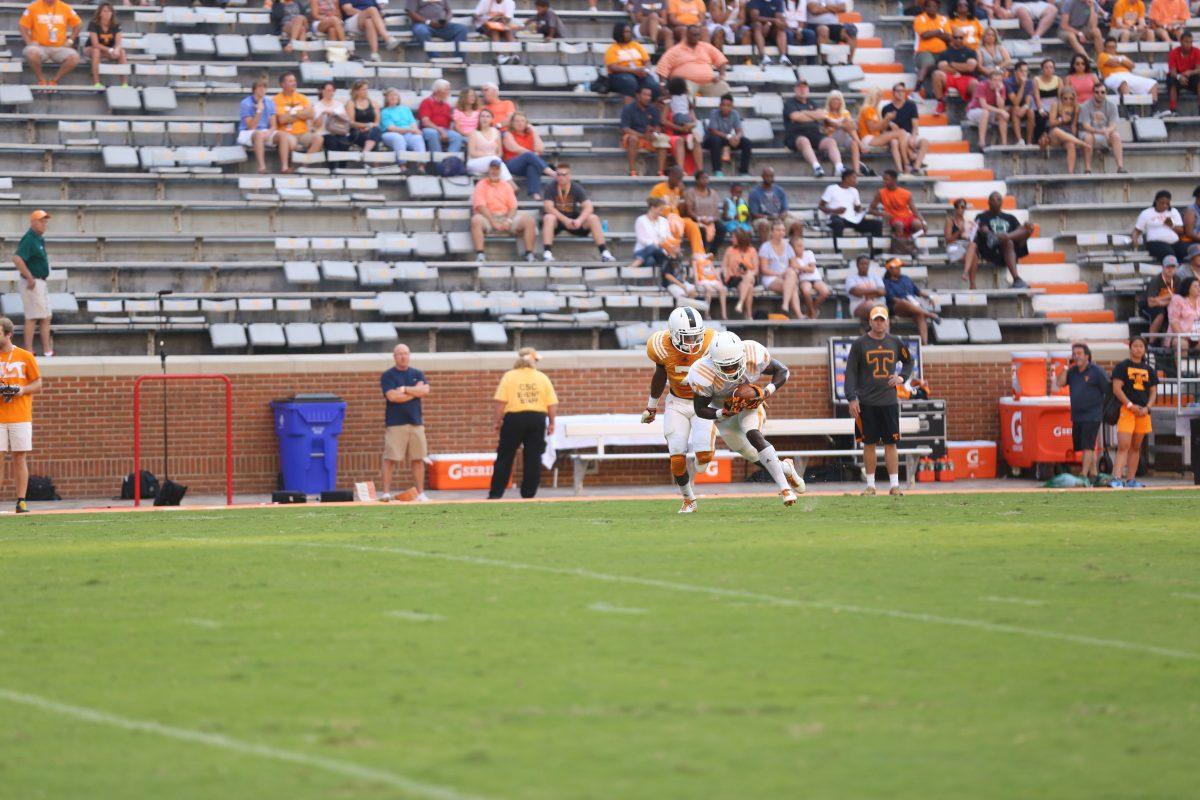 Freshman cornerback Rashaan Gaulden prepares to tackle a running back during open practice in Neyland Stadium on August 16.