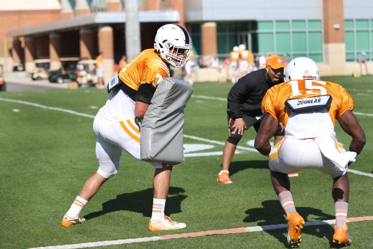 Freshman running back Jalen Hurd runs drills with senior running back Marlin Lane at spring practice on April 1, 2014.