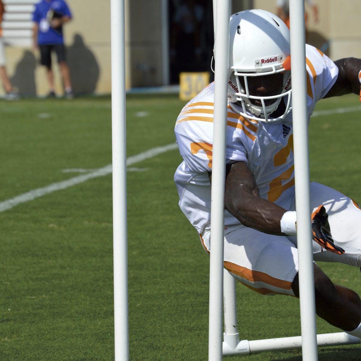 Wide receiver Pig Howard runs agility drills at practice Thursday.