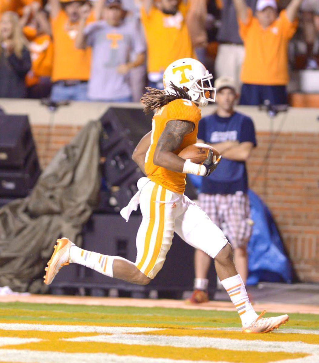 Von Pearson scores a touchdown during the game against Utah State.