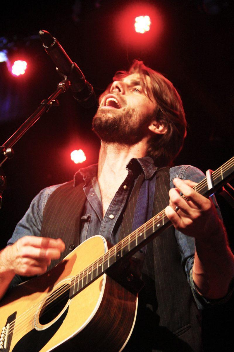 James Trimble, lead singer of the Knoxville band The Dirty Guv'nahs, sings and plays the guitar at the Bijou Theatre.