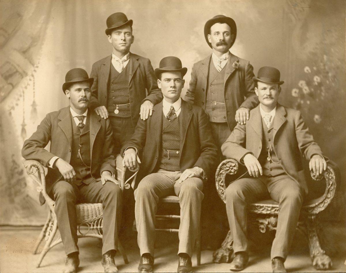 Kid Curry stands, right, in a portrait of Butch Cassidy's Wild Bunch. This photo was taken in 1900 in Fort Worth, Texas.