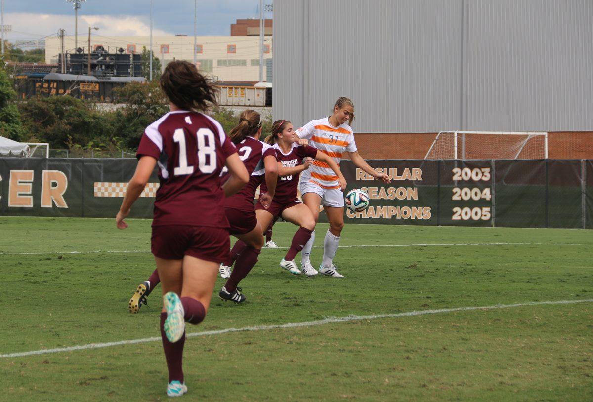 Sophomore forward Anna McClung, white, tries to regain control of the ball before scoring UT's first goal on Sunday against Mississippi State.