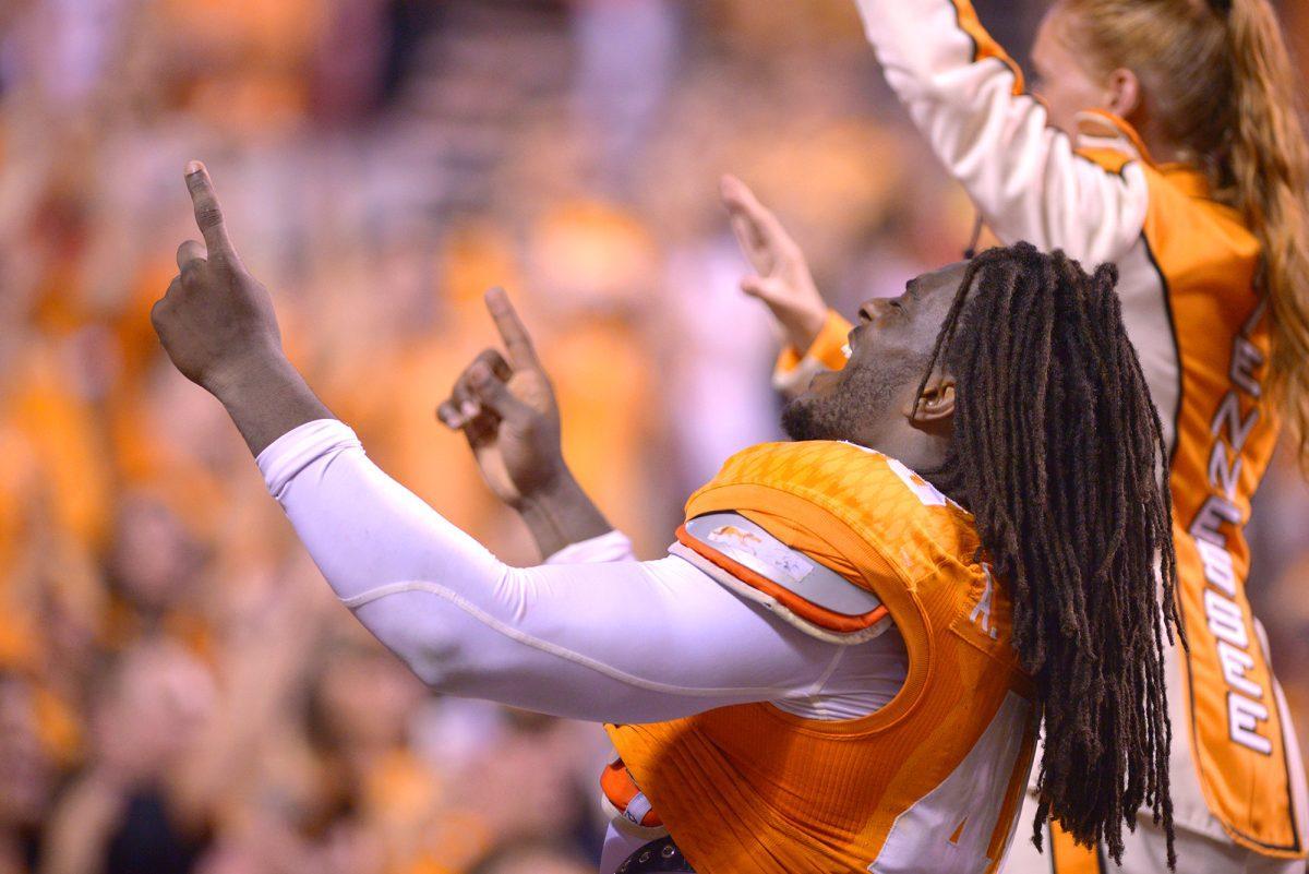 A.J. Johnson celebrates a play during the game against Utah State on August 31.