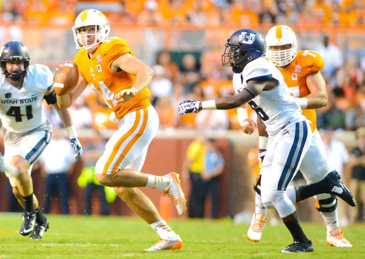 Senior Justin Worley runs with the ball during the game against Utah State on Aug. 31.