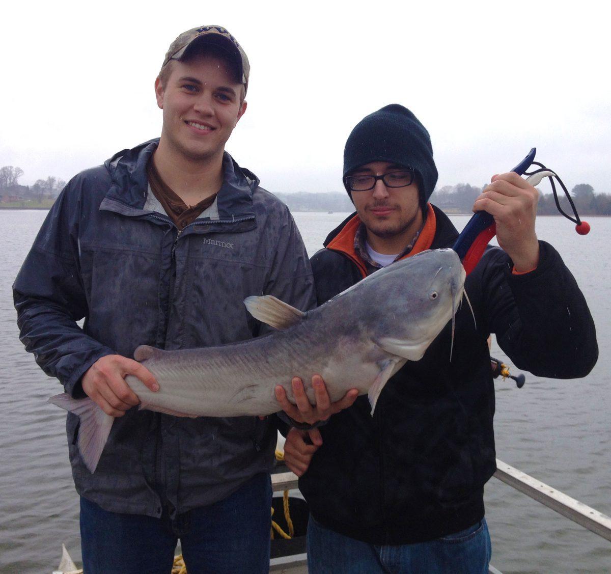Members of the first college Catfishing Club in America pose with one of their catches.