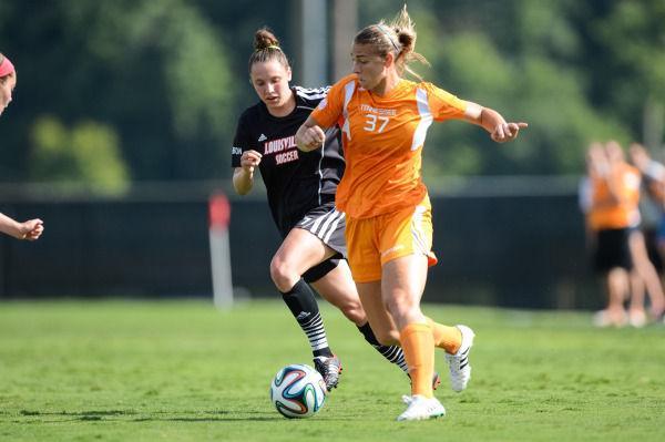 Lady Vols forward Anna McClung dribbles past a Louisville defender during UT's exhibition game with the Cardinals on Aug. 13 at Regal Stadium.