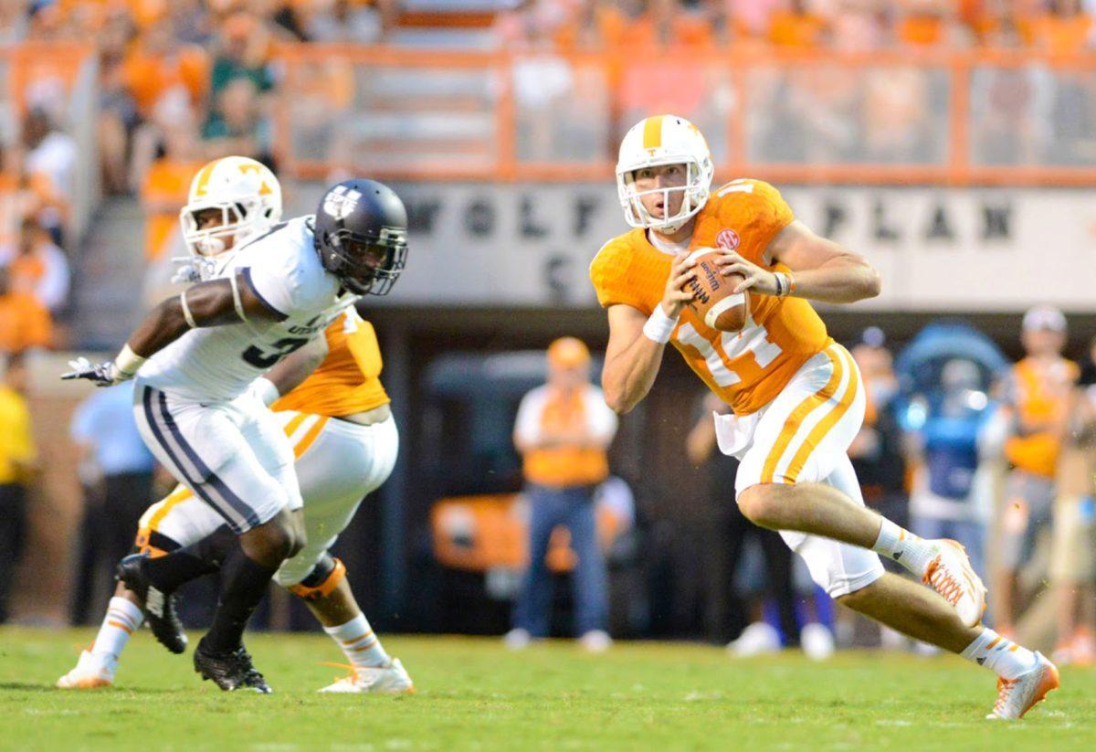 Justin Worley runs with the ball during Sunday night's game against Utah State.