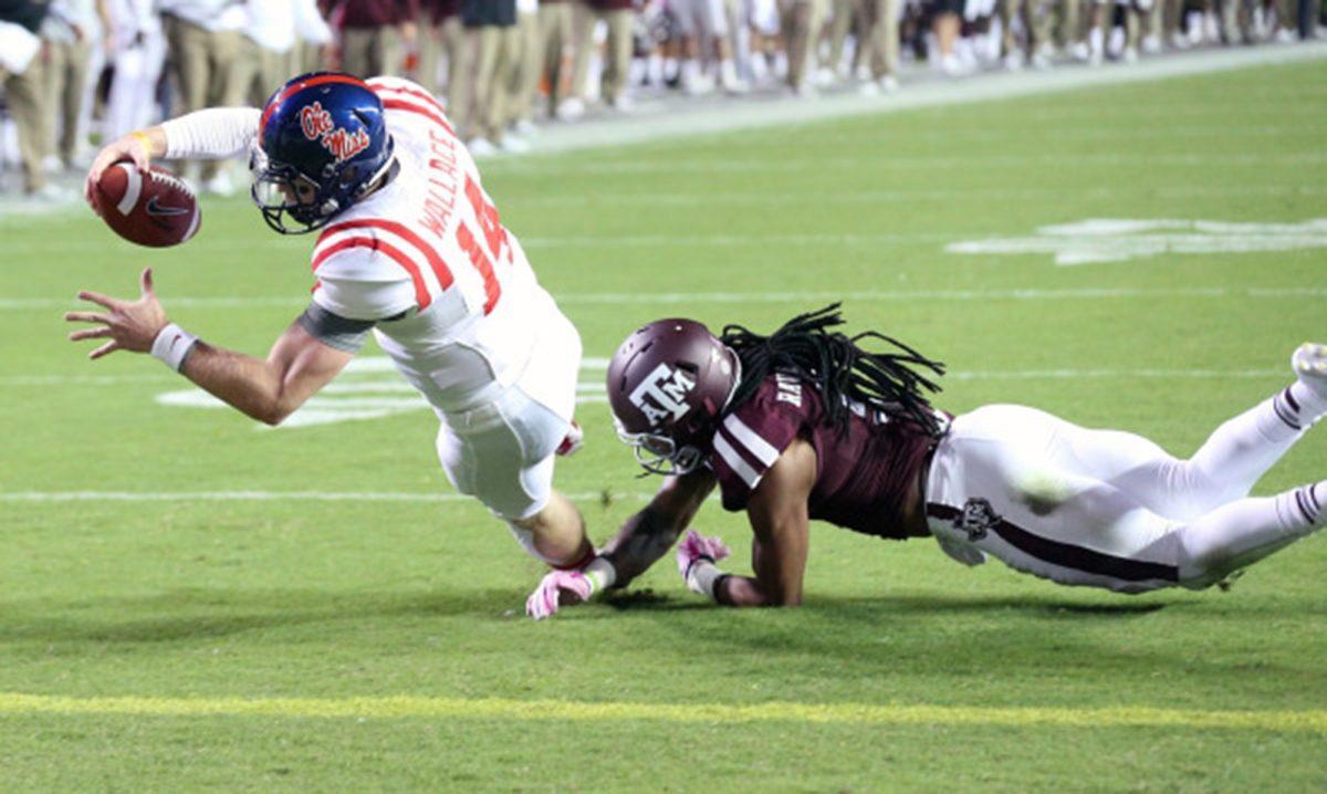 Senior quarterback Bo Wallace goes down during Ole Miss' victory over Texas A&amp;M on Oct. 11.