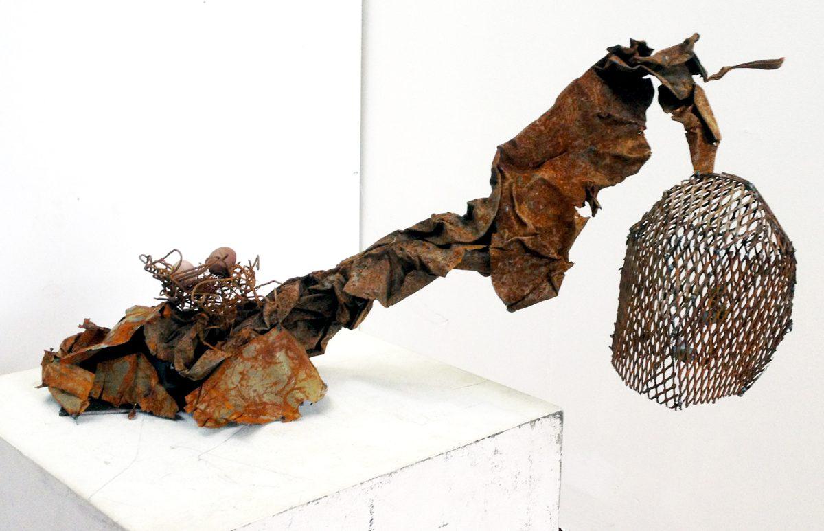 This metal sculpture, titled "Dead Tree: The Birds and Bees," is one of Danielle Sumler's art pieces which was showcased at the Ivan Racheff House Tuesday, April 29, 2014 to celebrate National Recycling Month.