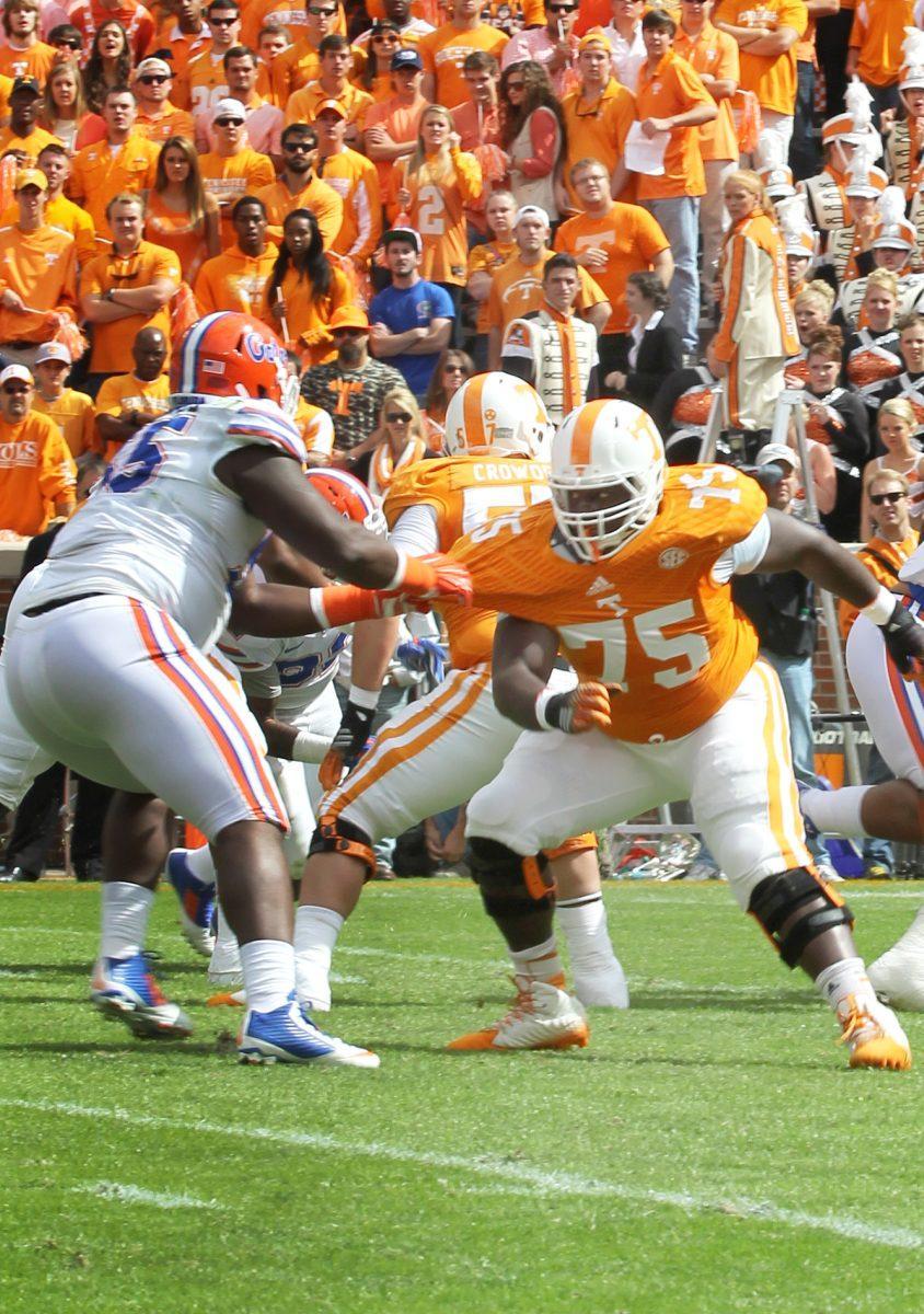 Junior left guard Marcus Jackson blocks an opposing Florida defensive lineman in the Vols' contest against the Gators on Oct. 4.