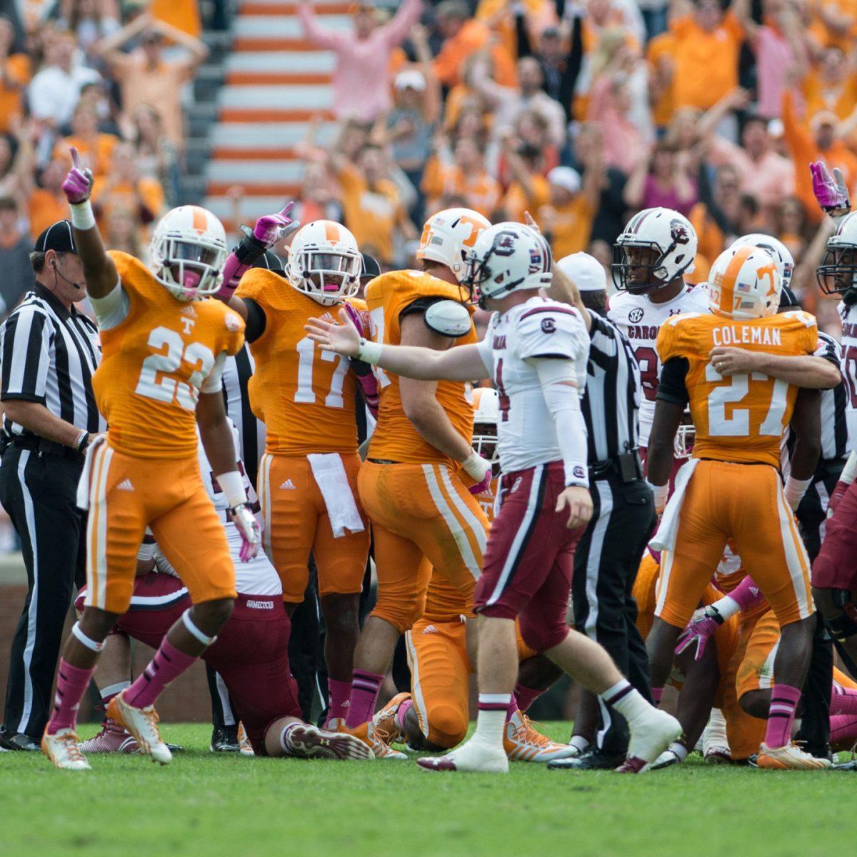 Sophomore cornerback Cam Sutton, left, celebrates a call in UT's favor during the 2013 game against South Carolina. After last year's victory, the Vols expect the Gamecocks to seek revenge Saturday.