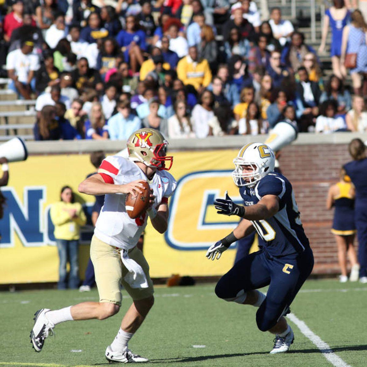 Chattanooga defensive end Davis Tull chases down Virginia Military Institute quarterback Al Cobb during the Mocs' 55-7 win on Oct. 4 at Finley Stadium.