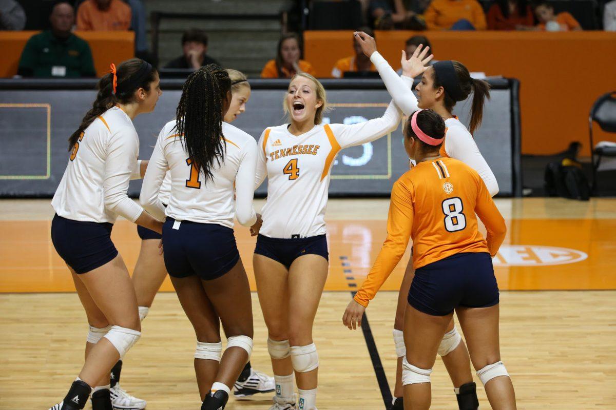 Lexi Dempsey, center, celebrates after a play the during the match against the Alabama Crimson Tide on Oct. 5.