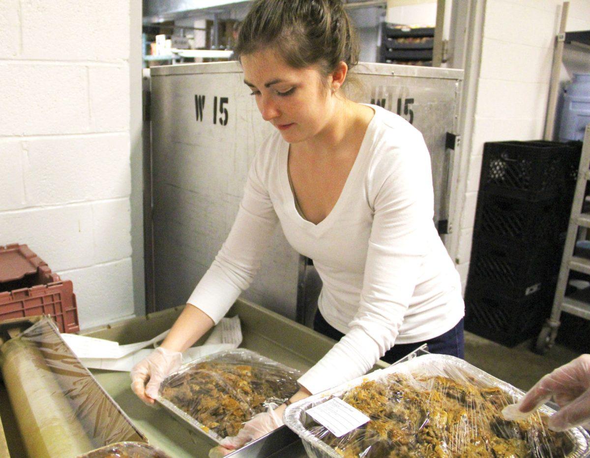 A student works as a part of the Food Recovery Network, which aims to reduce food waste and feed the hungry.