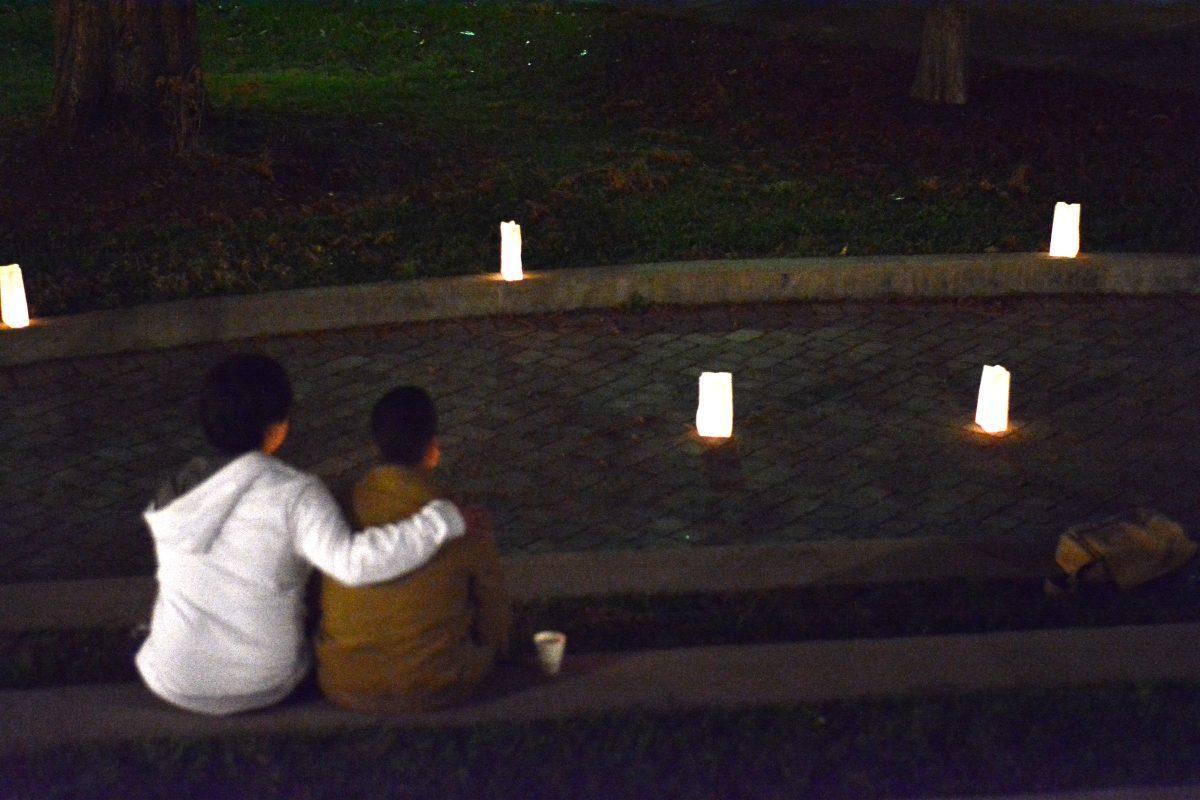 Students embrace during the Transgender Day of Remembrance in the HSS Amphitheater on Nov. 22, 2013. The Lambda Student Union hosted the event to honor victims of transgender violence.