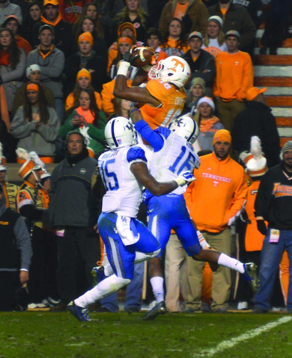Sophomore wide receiver Jason Croom leaps to catch a ball amid a swarm of Kentucky defensive players on Saturday.