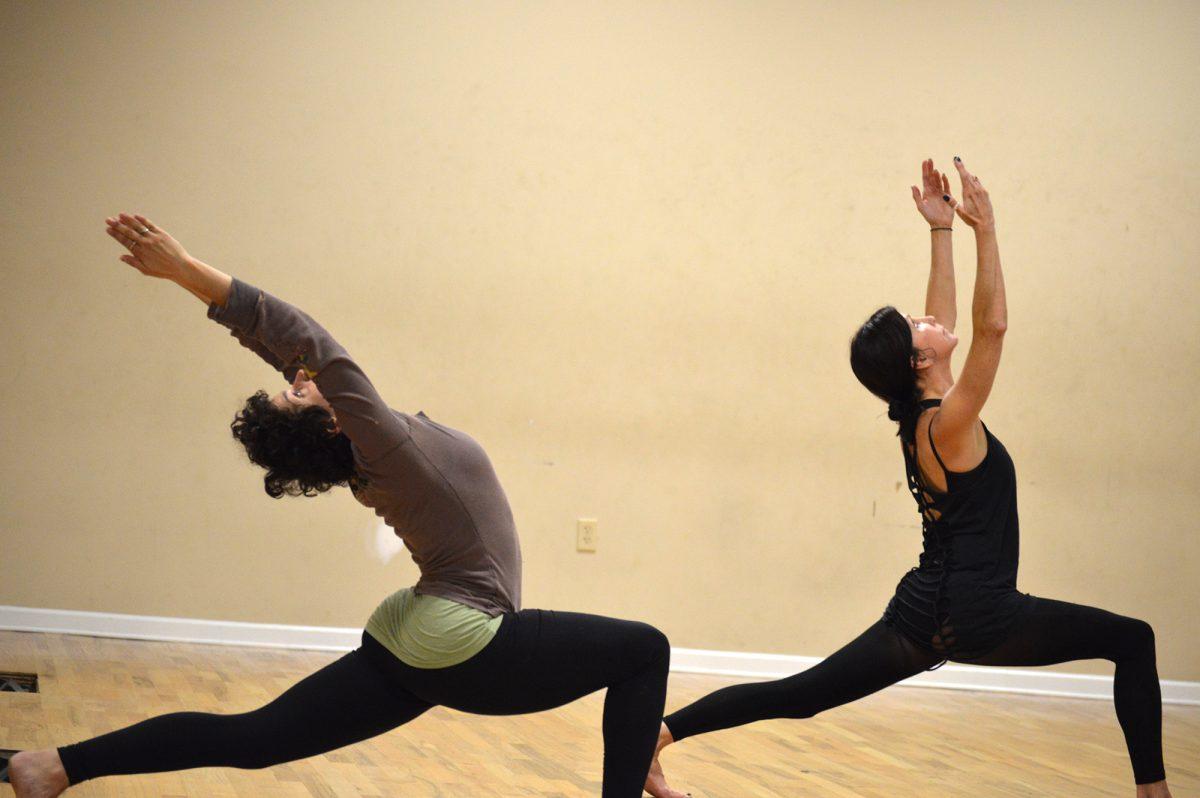 Dancers stretch during a Circle Modern Dance practice.