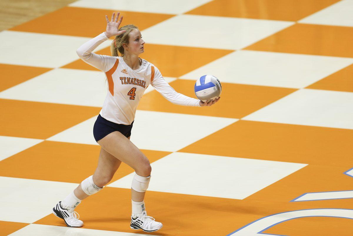 Junior setter Lexi Dempsey prepares to serve during the match against the Missouri Tigers on Nov. 7.