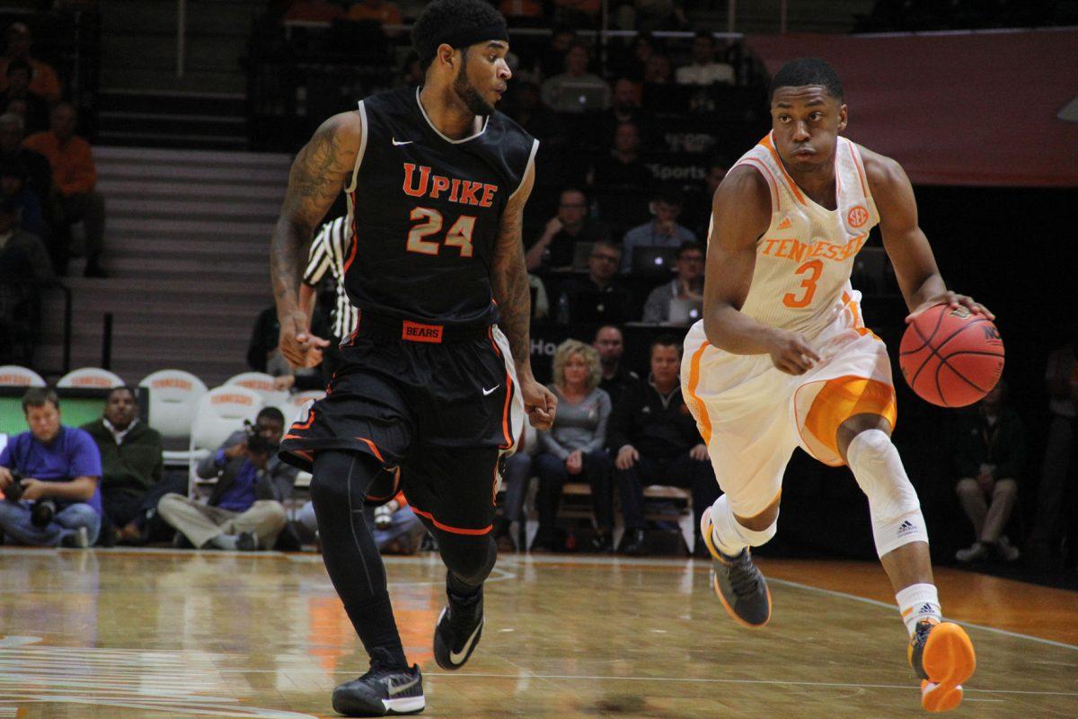 Sophomore guard Robert Hubbs III dribbles down the court during UT's game against University of Pikeville.