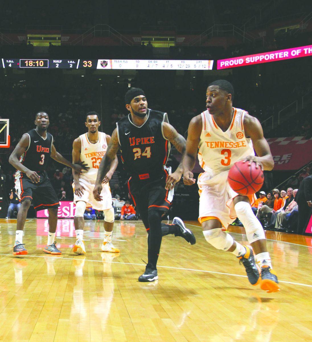 Sophomore guard Robert Hubbs III dribbles down the court during the game against University of Pikeville.