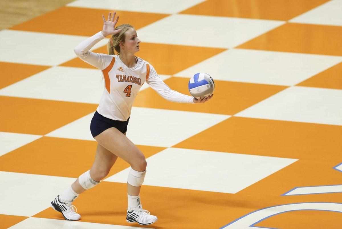 Junior setter Lexi Dempsey prepares to serve during the match against the Missouri Tigers on Nov. 7.