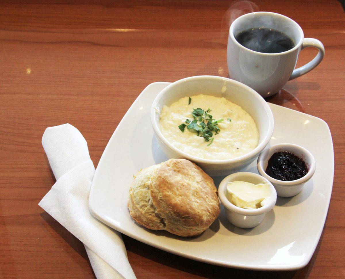 A bowl of grits and a buttermilk biscuit are some of the delicious food items ordered from The Plaid Apron.