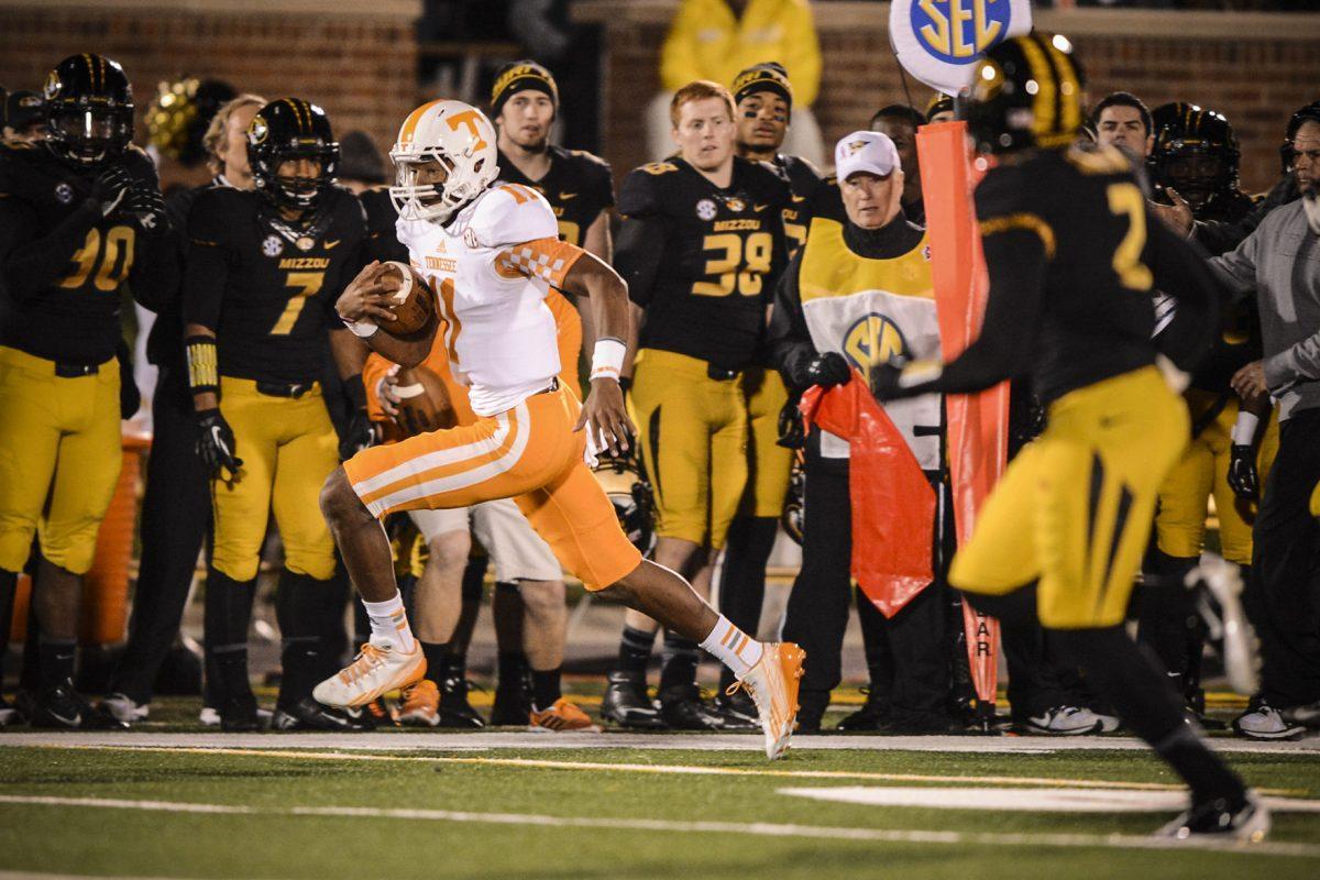 Sophomore quarterback Joshua Dobbs rushes during the SEC matchup between the Tennessee Volunteers and the Missouri Tigers on Faurot Field in Columbia, Mo. on Nov. 2, 2013.