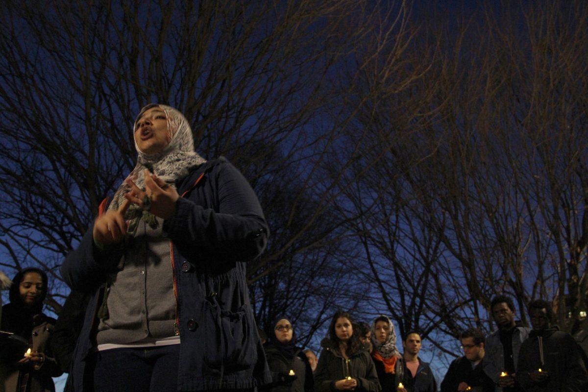 Drost Kokoye led a candle-light vigil in Circle Park on Wednesday evening for the three Muslim students who were shot and killed at the University of North Carolina at Chapel Hill.