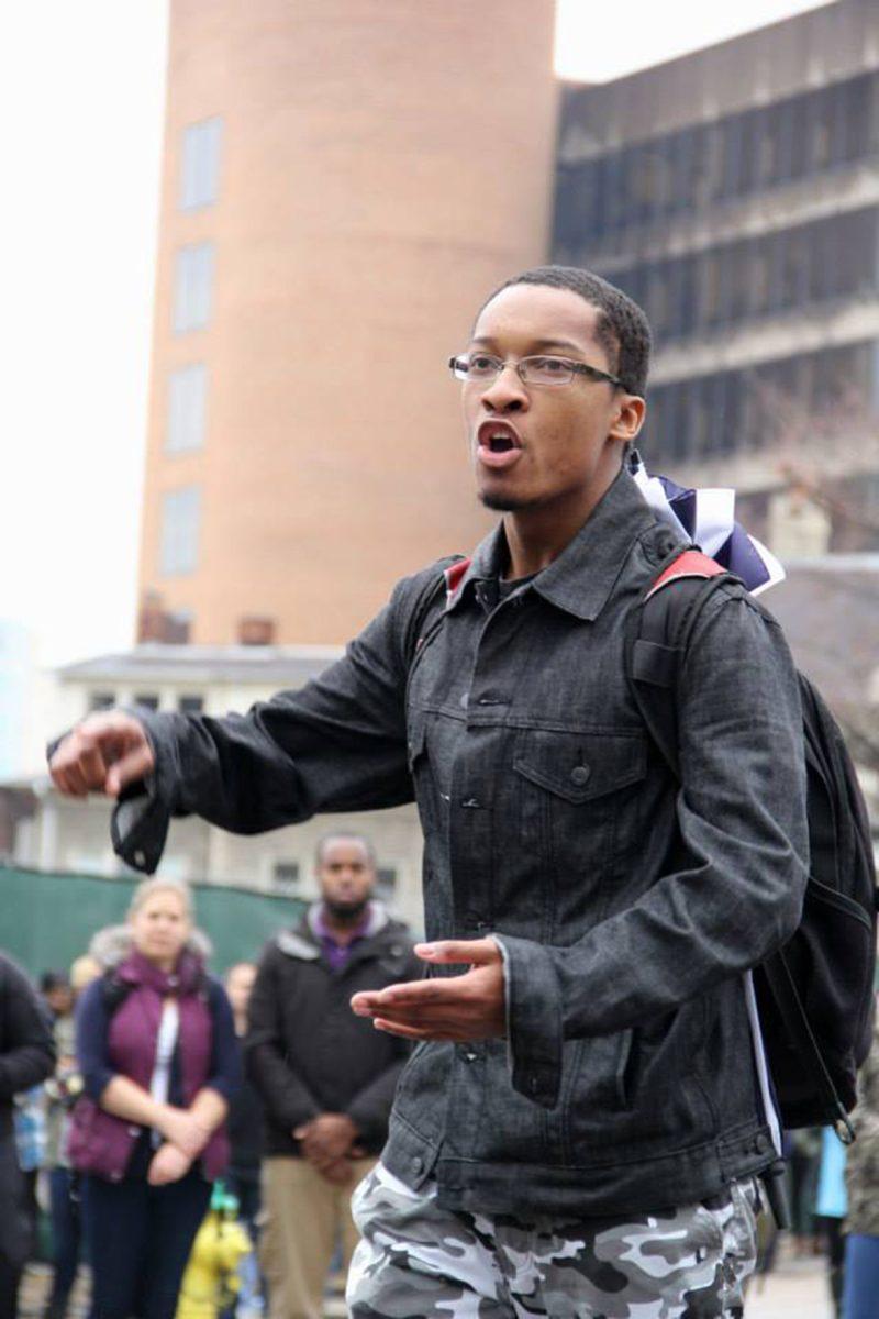 Corey Hodge, senior in Africana Studies, speaks on Dec. 2 in front of a crowd of people protesting the Ferguson decision.