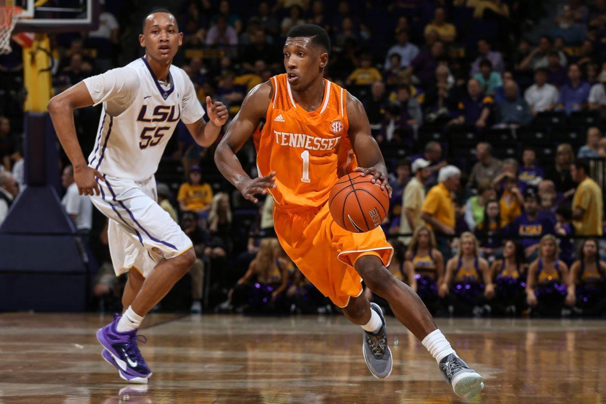Senior guard Josh Richardson sweeps past LSU defender Tim Quarterman during the Vols victory on Wednesday.