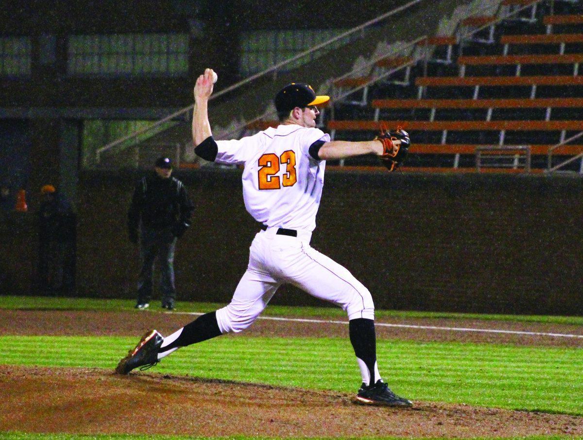 Freshman Zach Warren pitches during the game against MTSU on March 3. The game was cancelled during the third inning due to inclement weather.