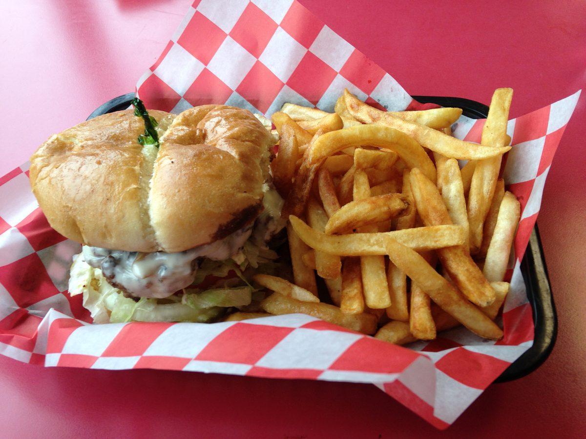 Nick &amp; J's Cafe in Turkey Creek serves many breakfast and lunch options, like this burger and fries combination.