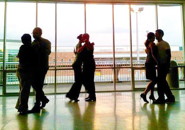 Couples practice dancing at Vol Tango, a community to learn Argentine Tango.