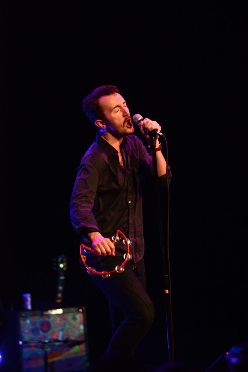 Lead singer Will Horton shakes the tambourine during The Black Cadillacs' performance on April 17 at the Bijou Theatre.