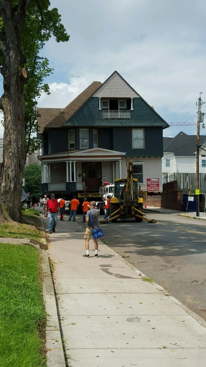 One block from the house's new location, the transport crew waits on electricians to clear the way.