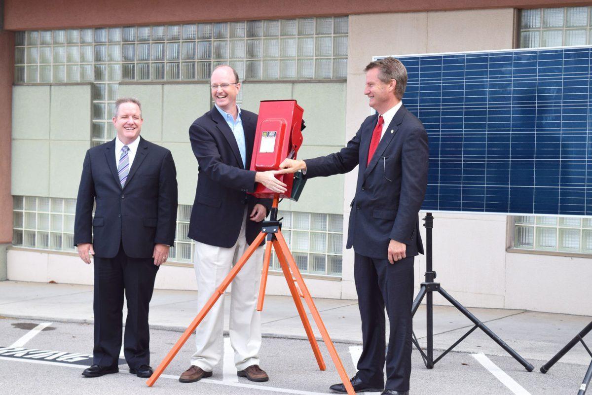 Knox County Mayor Tim Burchett and Knox County Schools Superintendent Jim McIntyre turn on the first panel's power switch together.