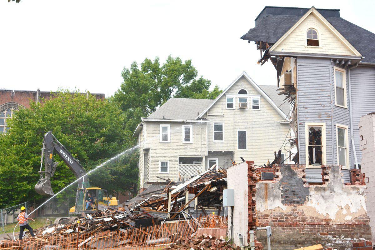 Workers tear down the 301 White Avenue house on Sept. 9, 2015. Located near Vol Hall, the house's style was a typical late Victorian architecture found throughout the Fort Sanders neighborhood.