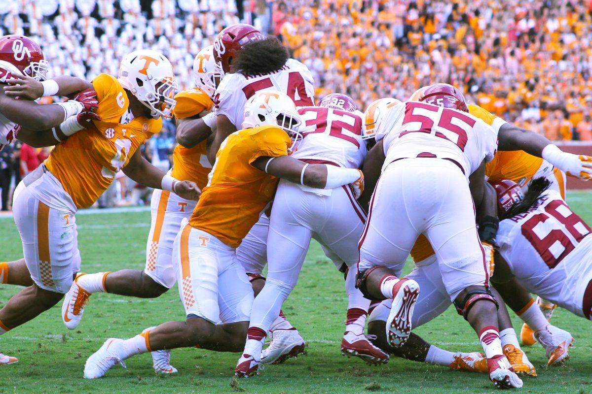 Sophomore defensive back Todd Kelly Jr. tackles a Sooner during the game against Oklahoma on Sept. 12.