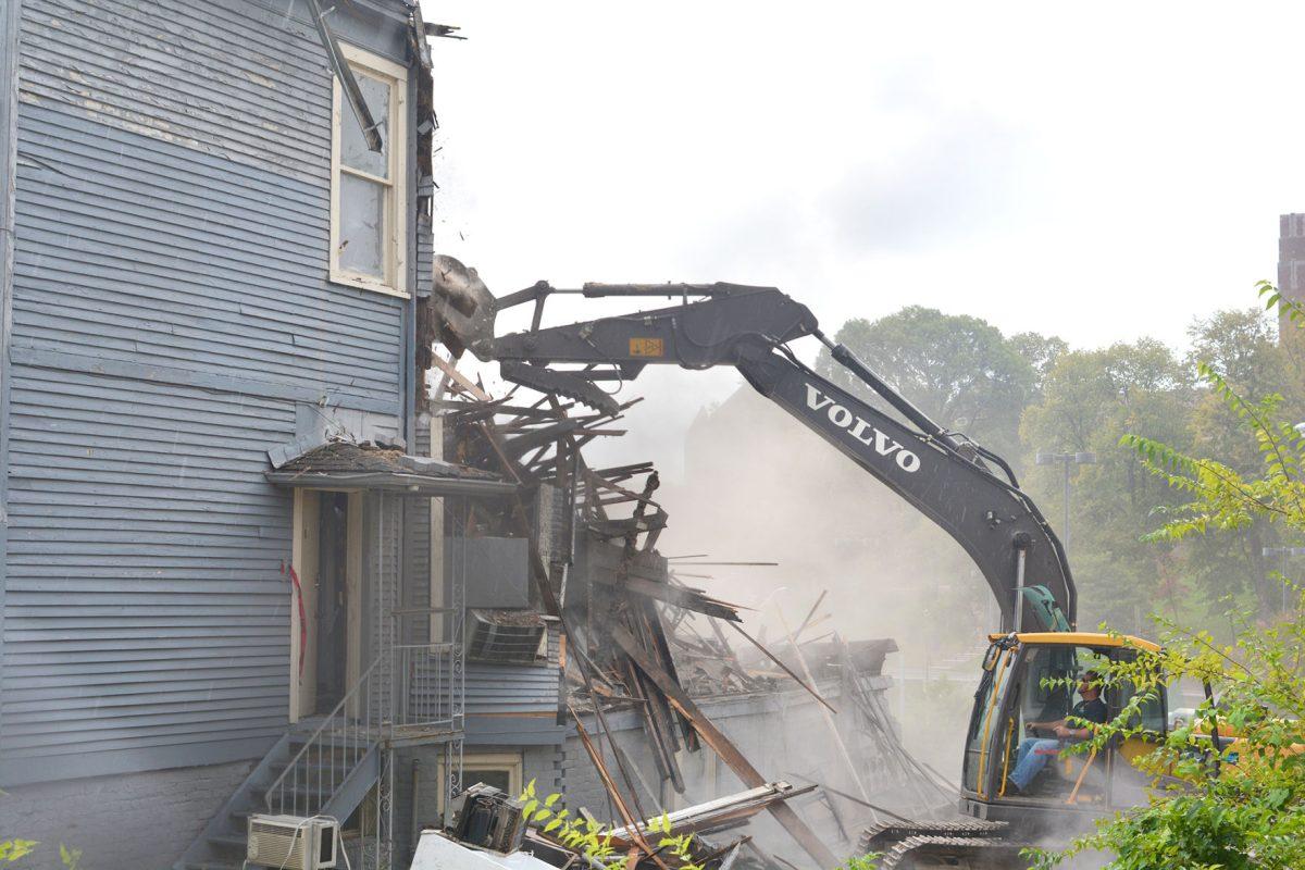 Workers tear down the 301 White Avenue house on Sept. 9, 2015. Located near Vol Hall, the house's style was a typical late Victorian architecture found throughout the Fort Sanders neighborhood.