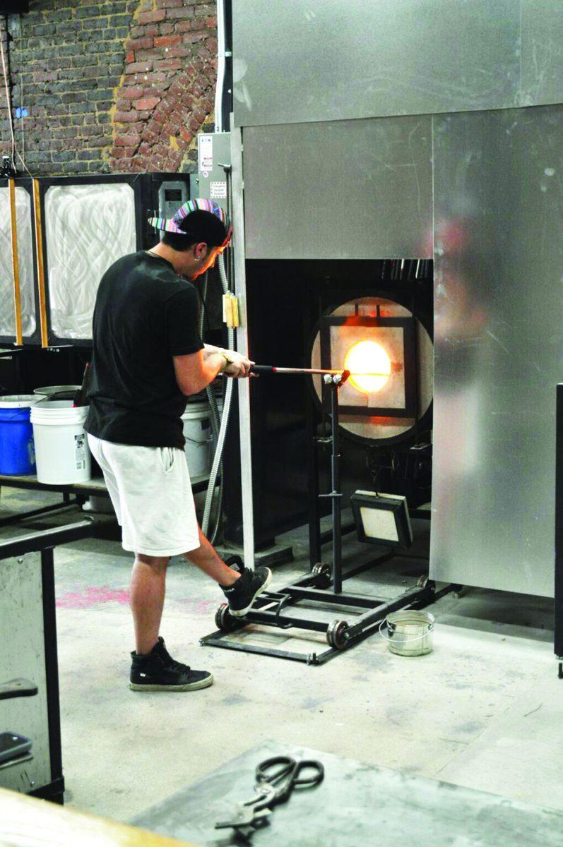 Sam Meketon working in the Matthew Cummings studio at Pretentious Beer Glass Company.