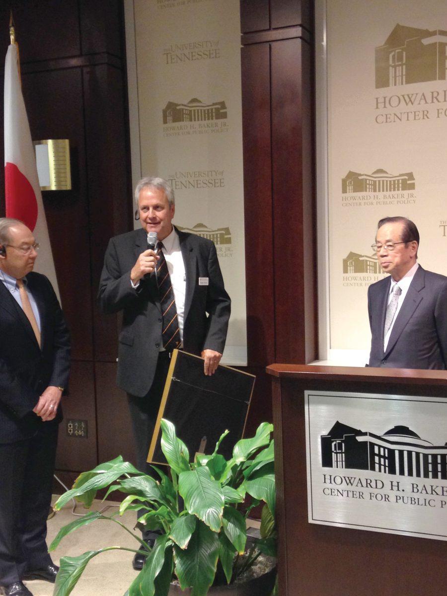 Chancellor Jimmy Cheek (left) and Director of the Baker Center Matt Murray (center) present Yasuo Fukuda (right) with a signed painting from former Japanese Ambassador Howard Baker.