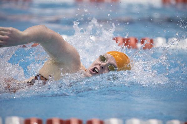 Tennessee sophomore swimmer Faith Johnson sprints to the finish during the swim meet against Missouri and Virginia Tech on Jan. 11. in the Allan Jones Aquatic Center.