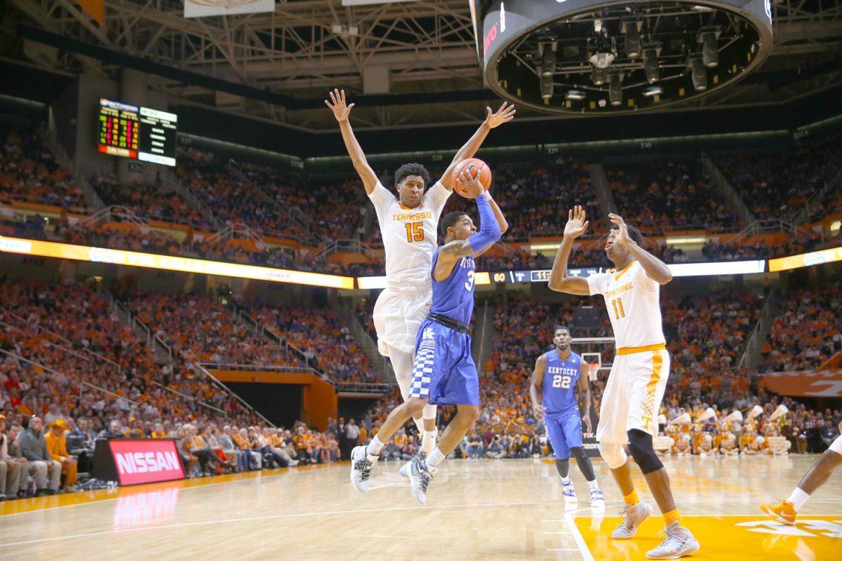 Kyle Alexander and Detrick Mostella attempt to prevent a score from Kentucky.