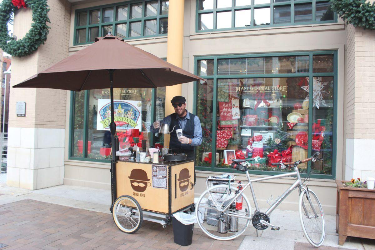 Andrew Mrozkowski serves customers outside of Mast General Store on Gay Street.