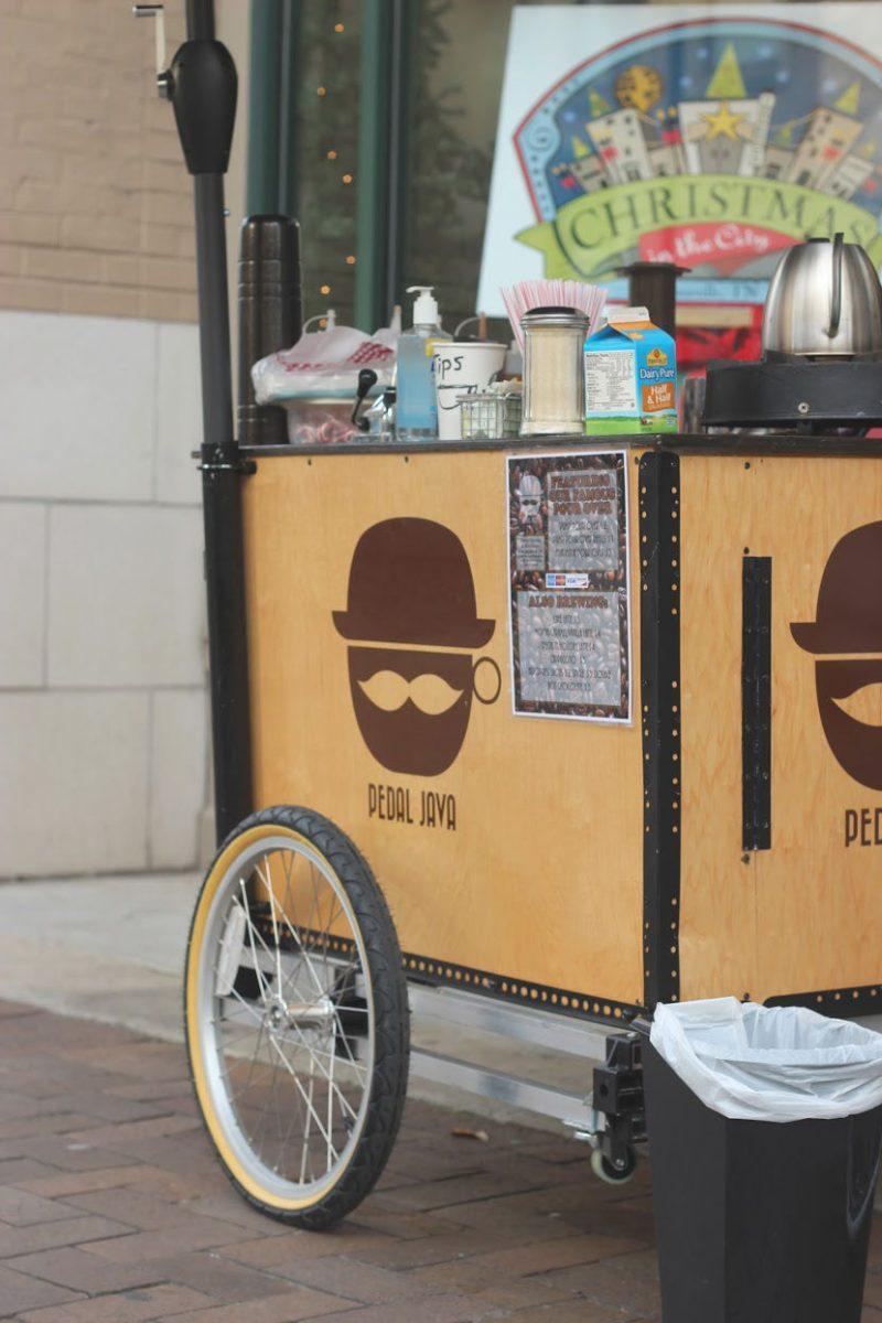 Andrew Mrozkowski serves customers outside of Mast General Store on Gay Street.