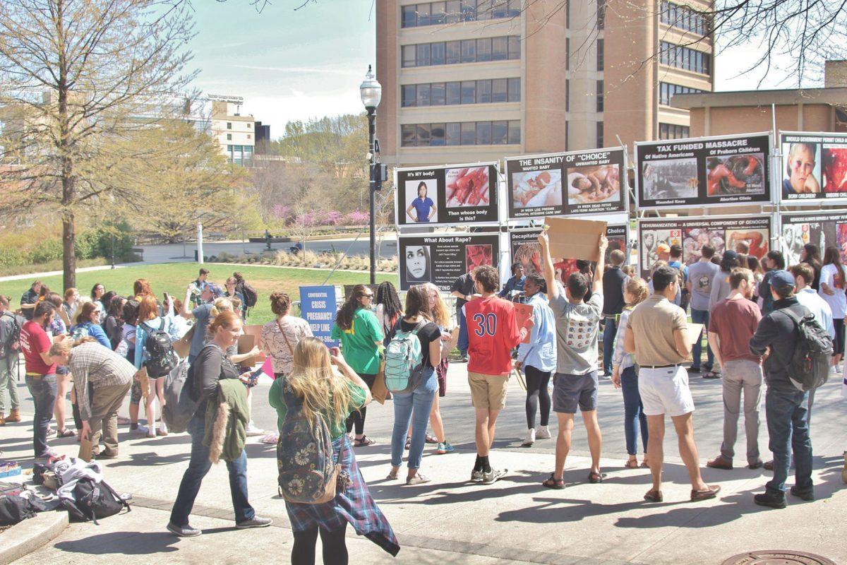 Counter-protesters stand outside the humanities building voicing their stance to the anti-abortion protests.