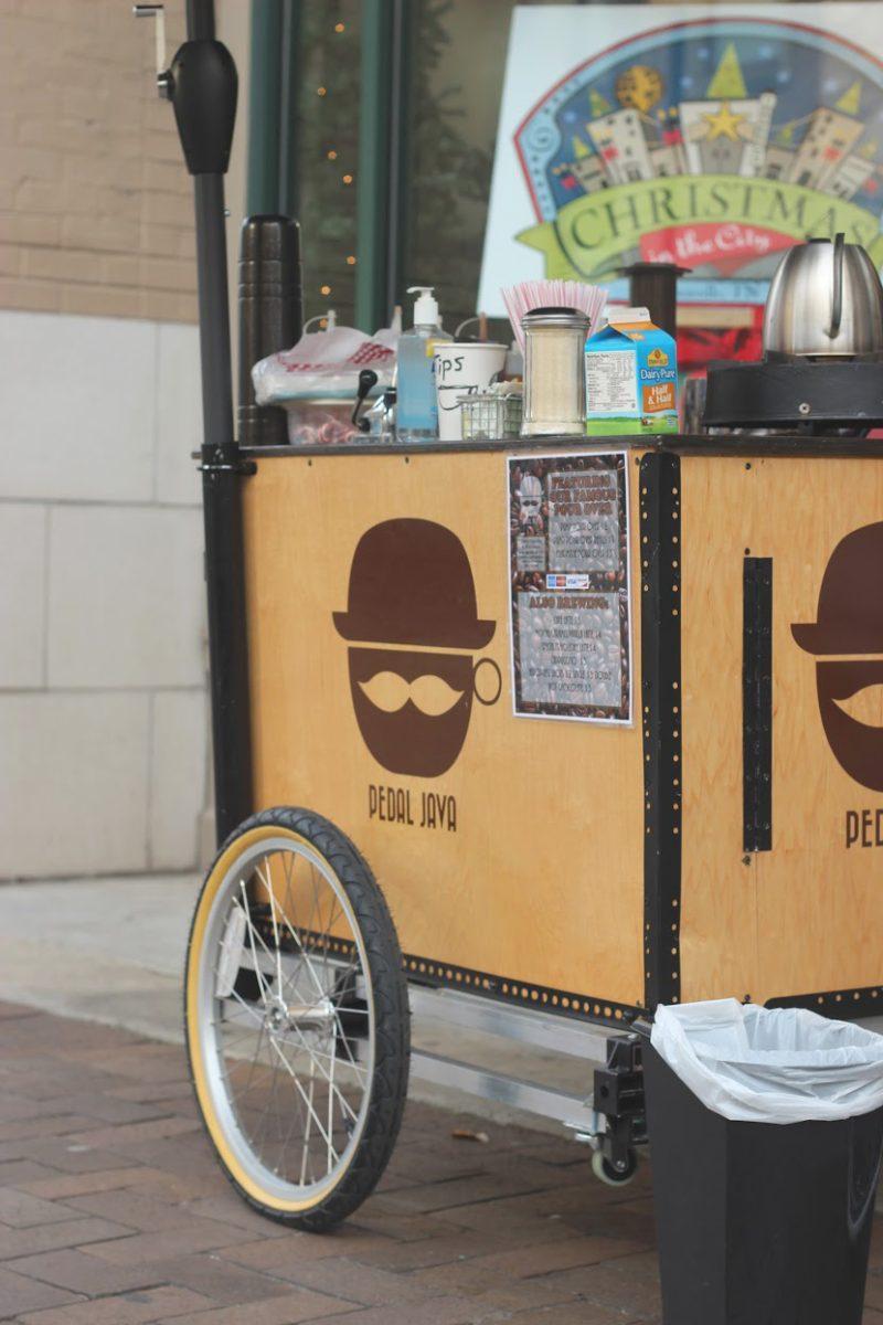 Andrew Mrozkowski serves customers outside of Mast General Store on Gay Street.