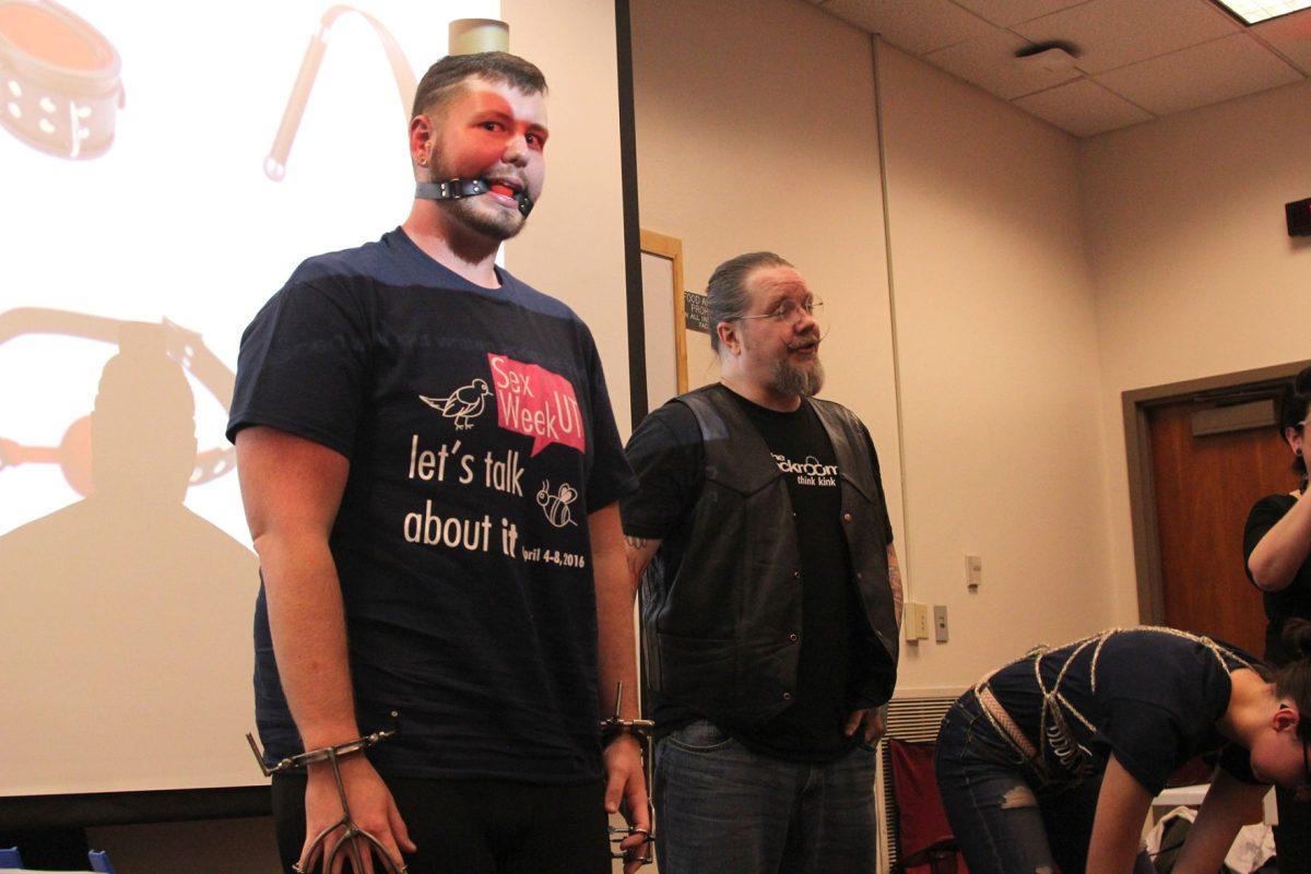 Sophomore college scholars major and SEAT Executive Board Member Josh Brown models a typical ball gag and hand restraints for the audience.